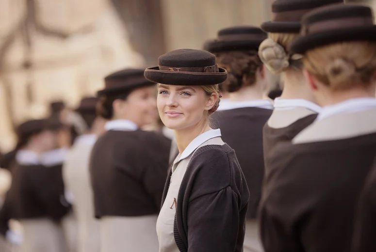 A female Norland Nanny at her graduation ceremony at Bath Abbey