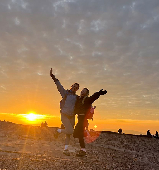 Norland students on sunrise hike at the top of a mountain