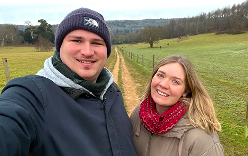 Couple smiling to camera outside