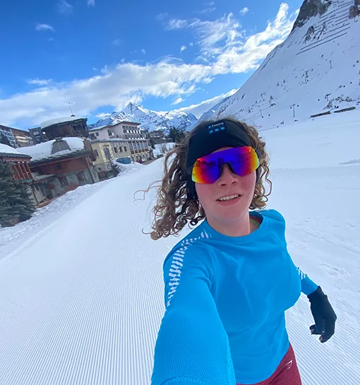 A female running in a snowy location